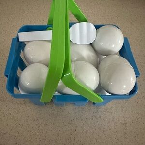 White Spheres in Blue Basket with Green Handle